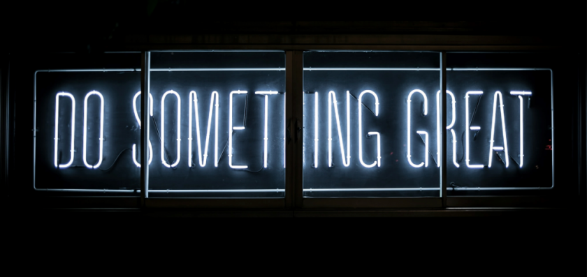 A neon sign that says do something great.